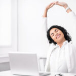 mexican manager stretching hands at work place