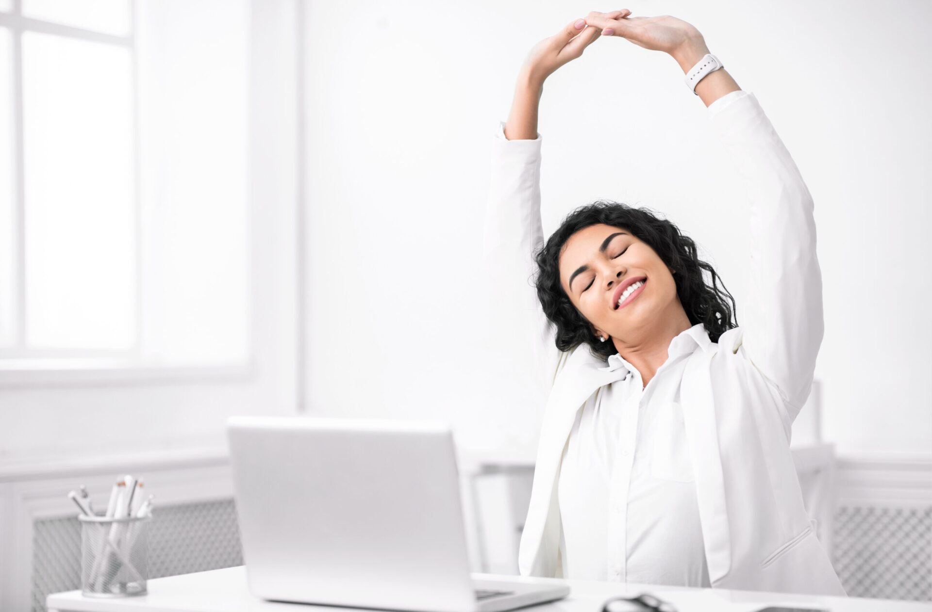 mexican manager stretching hands at work place